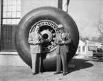 Air Accessories--two men with B-36 tire - (Closeup) by W. D. Smith