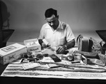 Man with Tandycraft (Tandy Leather Company) display by W. D. Smith