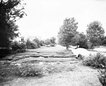 Pond and garden with house in the background by W. D. Smith