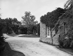 Driveway leading to stone house by W. D. Smith