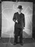 Man in a three-piece suit smoking a cigar by W. D. Smith