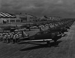 Planes and pilots on airfield by W. D. Smith