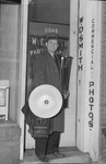 W.D. Smith standing in front of the door of his office by W. D. Smith