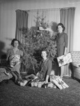 Family portrait around Christmas tree by W. D. Smith