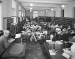 Students in library reading room by W. D. Smith