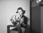 Woman posing in photography studio by W. D. Smith