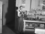 Man working in photography studio by W. D. Smith