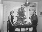 Gordon Smith and Laura Smith around a Christmas tree by W. D. Smith