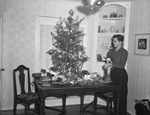 Gordon Smith around a Christmas tree by W. D. Smith