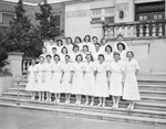 Nurses standing on front steps of a building by W. D. Smith