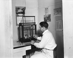 Man working in chemical lab by W. D. Smith