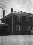 Exterior of an unidentified brick home by W. D. Smith