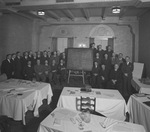 Swift & Company sales men posing with a blackboard containing sales figures by W. D. Smith