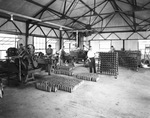 Shop workers operating machinery by W. D. Smith