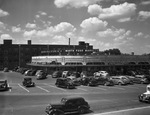 Parking lot of Renfro Drug Store and Worth Food Markets by W. D. Smith