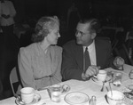 Man and woman sitting at a table together by W. D. Smith