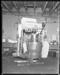 Pellet machine in warehouse by W. D. Smith