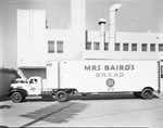 Mrs. Baird's Bread truck in front of the factory by W. D. Smith