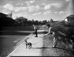 Man with dog on leash by W. D. Smith