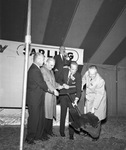 Carling Brewery officials using Texas shaped shovel for groundbreaking