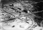 Aerial of Bain Peanut Co., 7th Street, looking northeast; Montgomery Ward building near top center, 02/20/1954 by W. D. Smith Commercial Photography