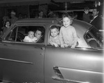 Children in car at Stock Show parade in downtown Fort Worth, 01/20/1956 by W. D. Smith Commercial Photography