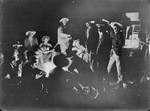 A western night scene with cowboys around campfire