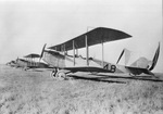 Bi-planes parked in a field by W. D. Smith Commercial Photography