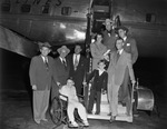 Barry Todd in a wheelchair with a group at the airport by W. D. Smith