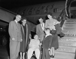 Barry Todd in a wheelchair with a group at the airport by W. D. Smith