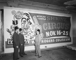 Men standing next to Moslah Temple Shrine Circus advertisement by W. D. Smith