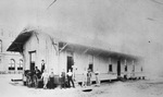 Group of people in front of Texas and Pacific Freight Station by W. D. Smith