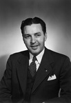 Portrait of a man in a suit and polka-dot tie by W. D. Smith