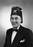 Portrait of a man wearing a suit and a Moslah Bedouins fez by W. D. Smith