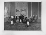 Portrait photograph of a wealthy family in a living room, pre-1900 by W. D. Smith