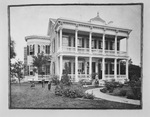 Portrait photograph of a wealthy family in front of their house by W. D. Smith