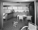 An eating area in a modern home by W. D. Smith