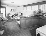 Cabinets and a living area in a modern home by W. D. Smith