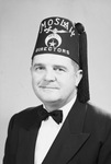 Portrait of man wearing a suit and Moslah Directors fez by W. D. Smith