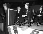 The Imperial Potentate in foreground and other Moslah officials seated on stage by W. D. Smith