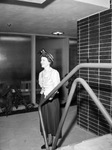 Miss Sanny Sue McCleery standing by stairs by W. D. Smith