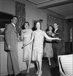 Guests in 1920s costumes at a party by W. D. Smith