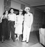 Party guests in their 1920s costumes by W. D. Smith