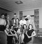 Men and women in 1920's costumes at a party by W. D. Smith