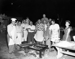 Group cooking outdoors by W. D. Smith