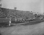 Al-Malaikah Bedouin band marching on a ball field by W. D. Smith