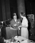 Moslah Shriner and woman in a hotel dining room by W. D. Smith