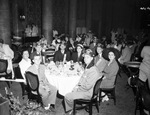 Shriners and a group in a dining room by W. D. Smith