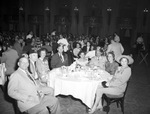 Shriners and a group in a dining room by W. D. Smith