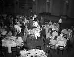 Shriners and a group in a dining room by W. D. Smith